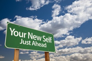 Your New Self Green Road Sign Over Dramatic Clouds and Sky.